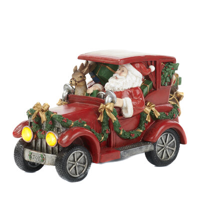 Kerstman in rode Jeep rijdend met kadootjes